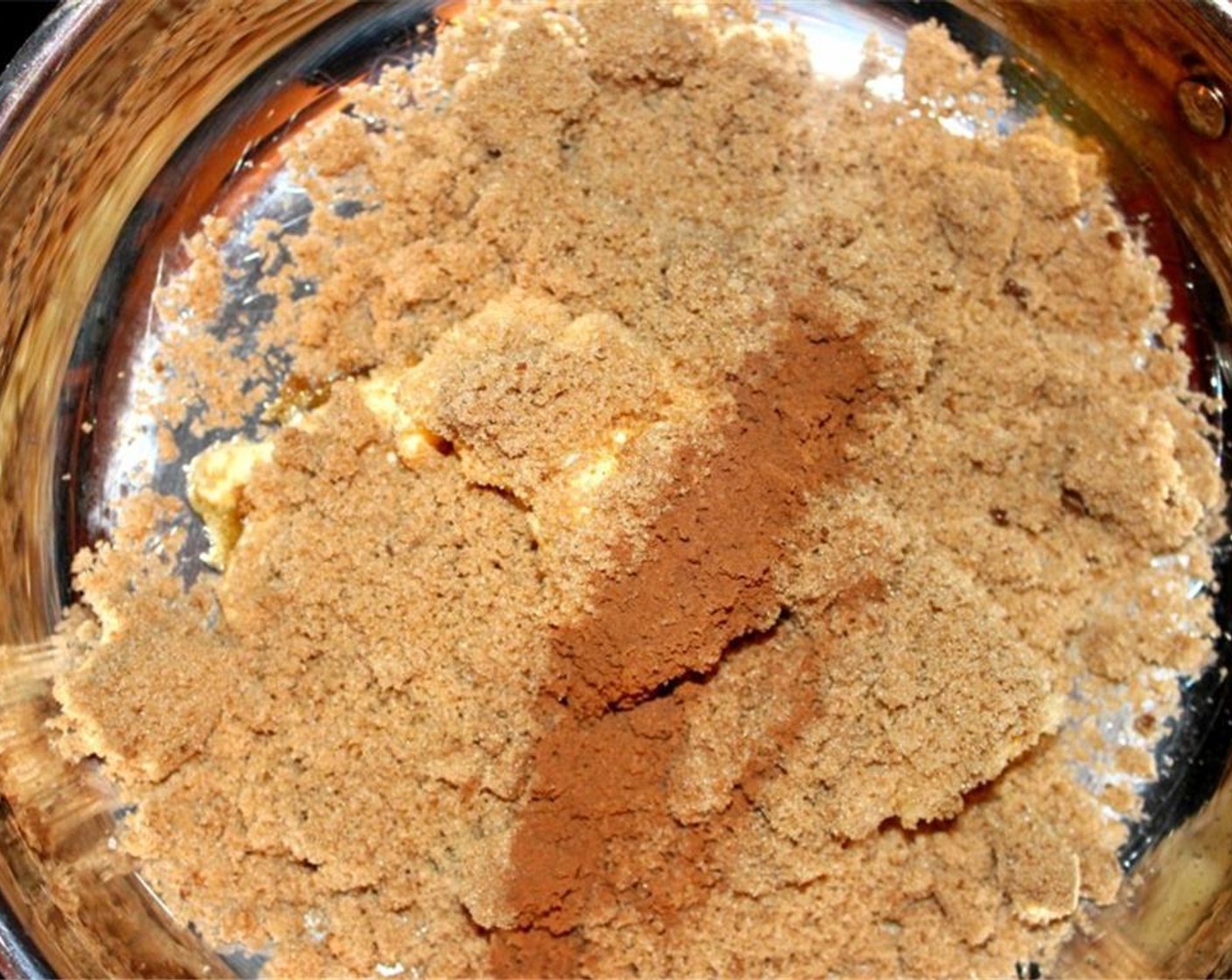step 5 In a medium pan add in the Butter (1/2 cup), Brown Sugar (1 cup) and Simply Organic Cinnamon, Ground (1 Tbsp).