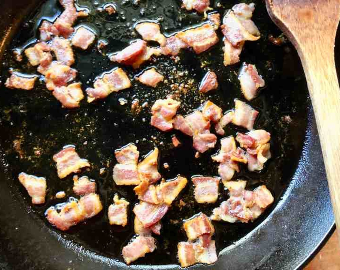 step 8 To the same skillet, add Bacon (4 oz) and cook until the bacon is crisp and the fat renders about 5 minutes.