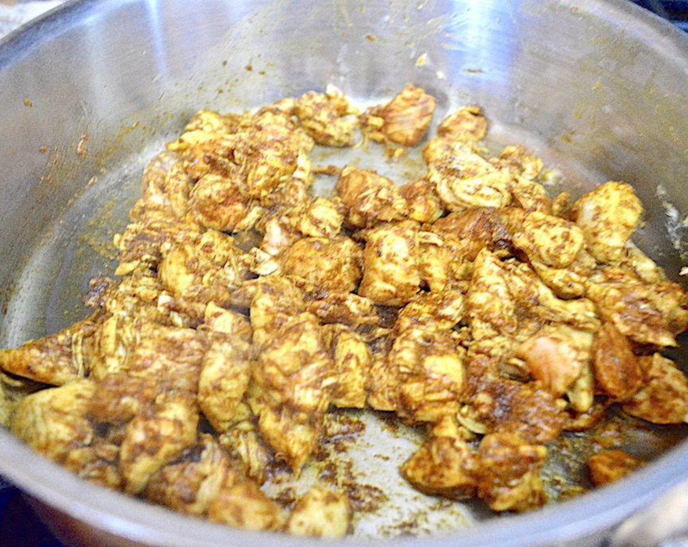 step 2 Get out a large skillet with deep sides and heat the Olive Oil (1 dash) in it over medium high heat. Add the Chicken Tenders (1 lb) and let it cook through completely for about 4-5 minutes.