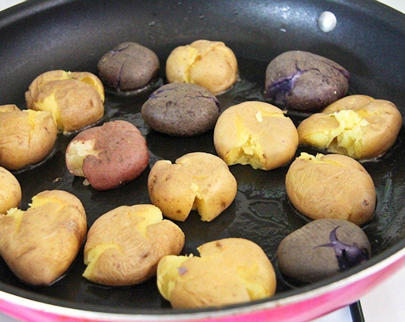 step 7 In a large pan, heat Olive Oil (2 Tbsp), and add the potatoes in one layer. Cook on one side until brown and crispy. Flip, and brown on the other side. Add more oil if necessary.