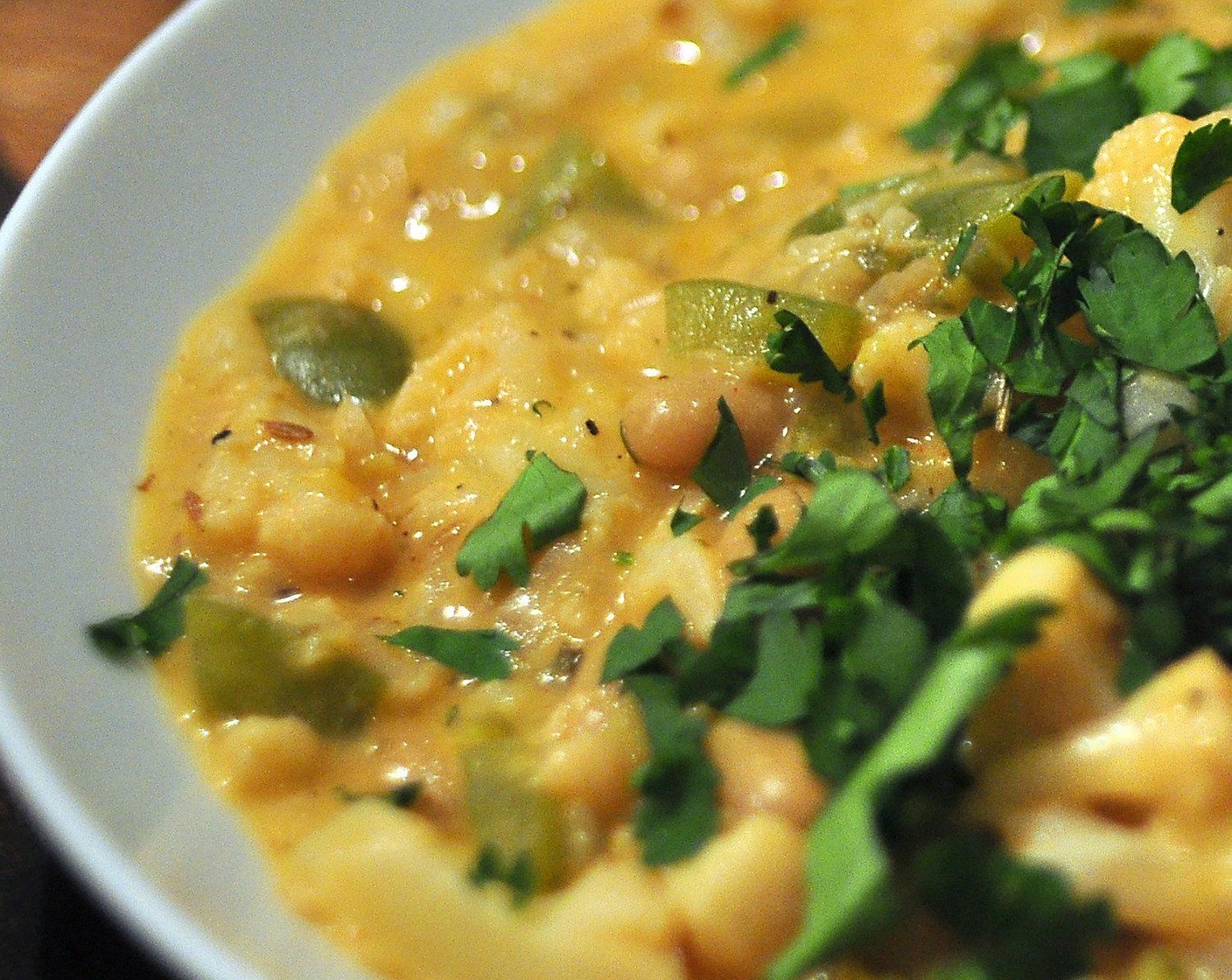 step 10 Serve the chili with a bit of Corn (1/2 cup) and Fresh Cilantro (to taste) on top with some nice crusty bread on the side. Enjoy!