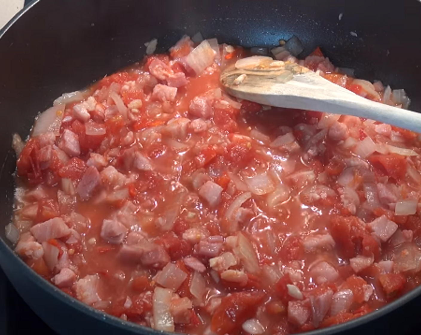 step 3 Add the Red Chili Pepper (1) and Canned Diced Tomatoes (1 3/4 cups) then stir to mix. Reduce the heat slightly and let simmer uncovered for five minutes or until the mixture thickens slightly.