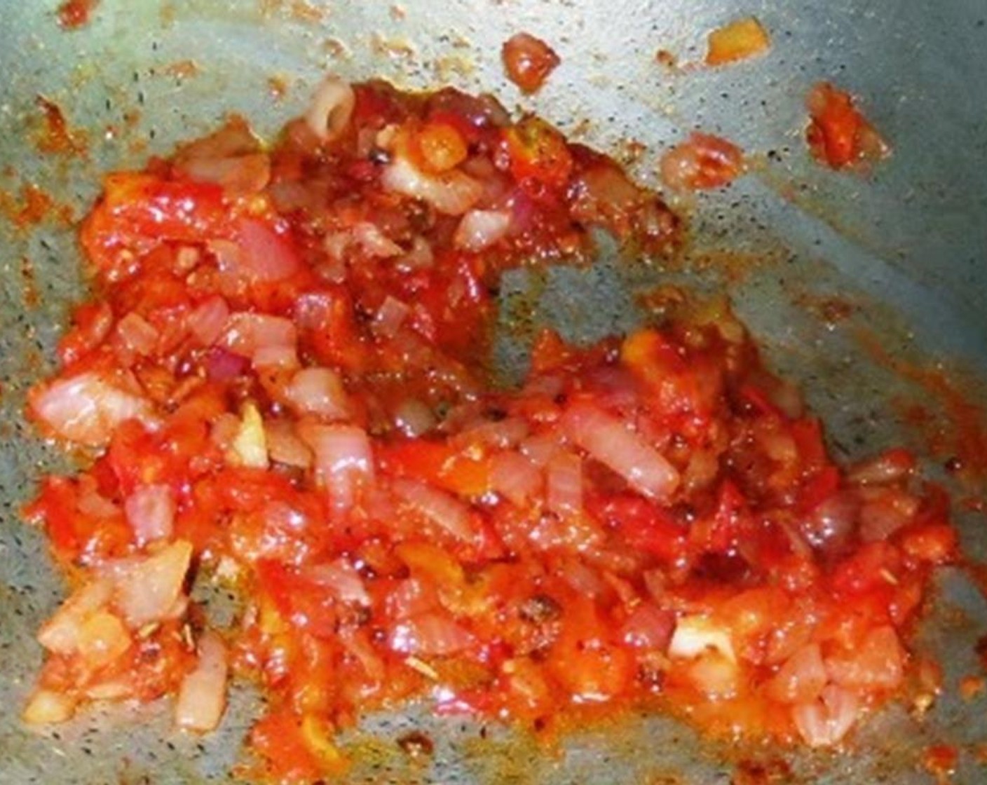 step 5 Once the tomato reduces to a mush, season with Salt (to taste) and Freshly Ground Black Pepper (1/2 Tbsp). Add Tomato Paste (1/2 Tbsp) and Dried Oregano (1/2 Tbsp). Mix well and let it cook for another 2-3 minutes.