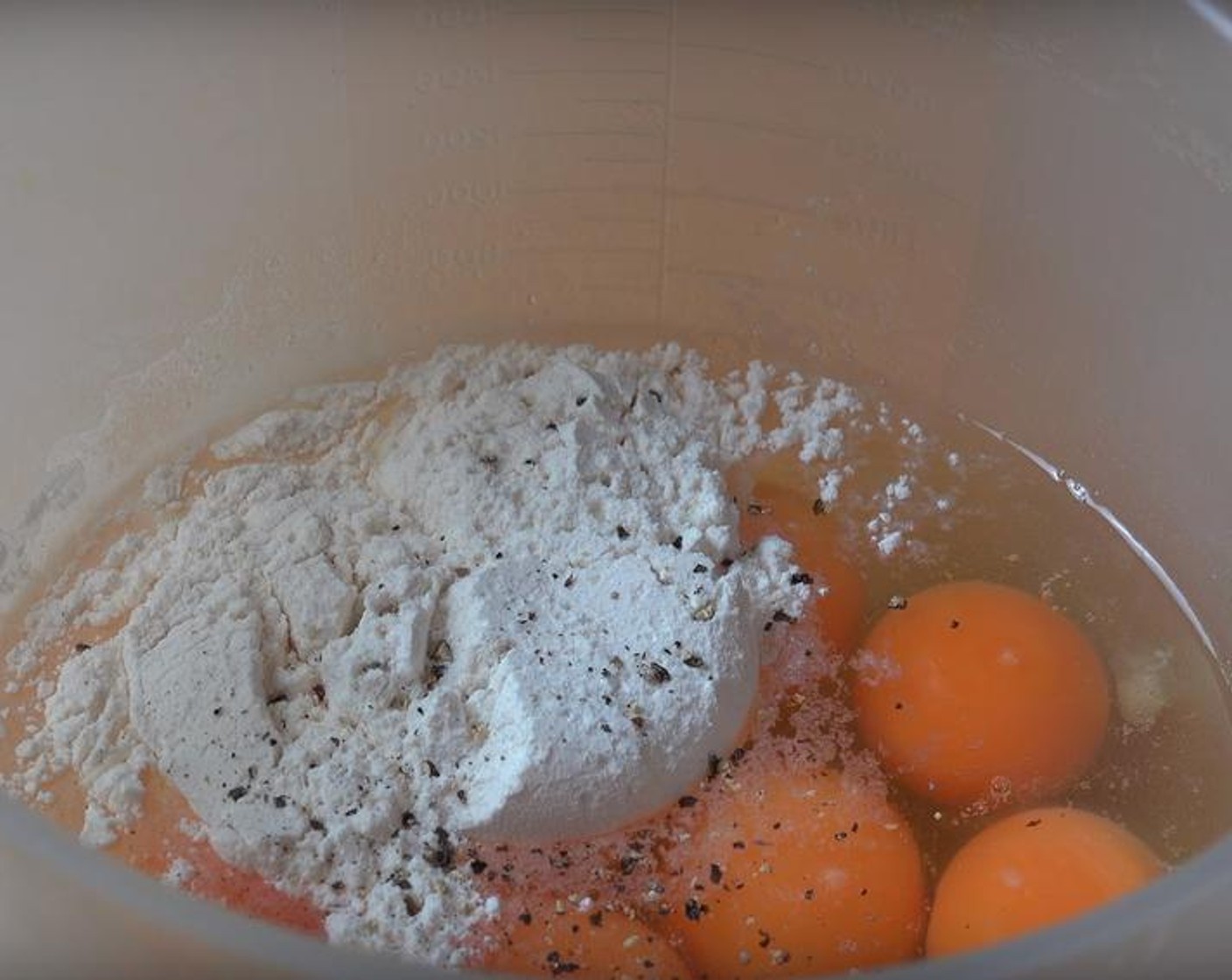 step 3 Put Eggs (10) in a large mixing jug. Add Self-Rising Flour (1/4 cup), Salt (to taste), and Ground Black Pepper (to taste). Stir the mix with a whisk until it's smooth.
