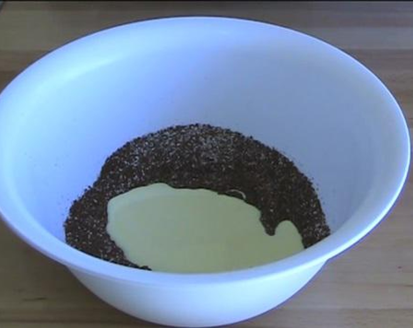 step 2 In a separate bowl, add and mix the Chocolate Biscuits (2 1/2 cups), Coconut (1/2 cup), Sweetened Condensed Milk (1 1/3 cups), and the melted chocolate mixture.