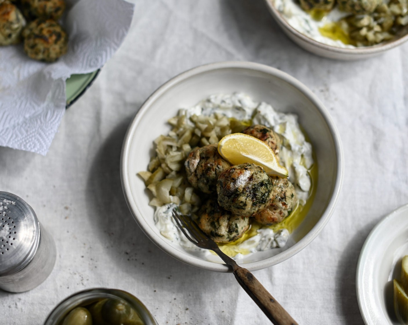 step 9 To serve, spoon a dollop of dill yogurt into a dish and top with extra chopped pickles, a few of the polpette, and a drizzle of olive oil over the top.