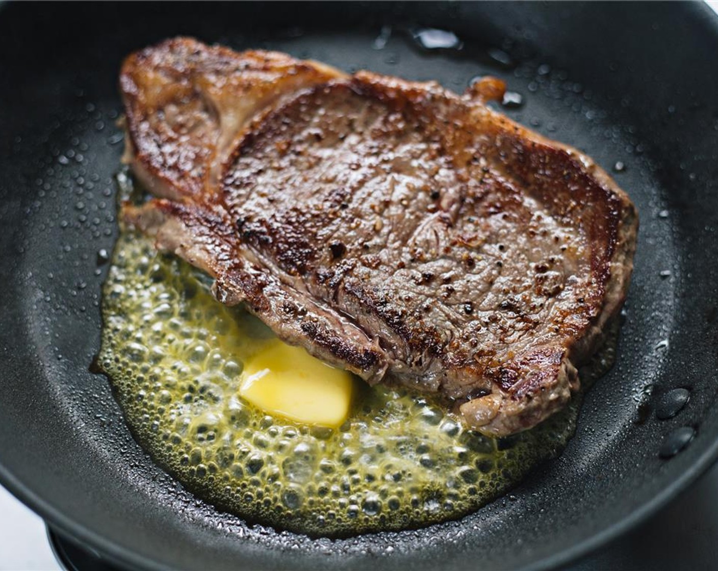 step 7 To finish off steak, place Unsalted Butter (1 Tbsp) in the pan, and let melt.