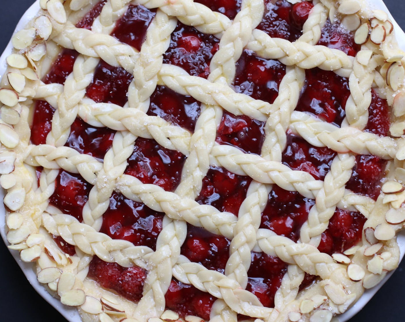 step 13 Place the pie onto a large baking sheet and bake for 20 minutes.  After the first 20 minutes of bake time, place a pie crust shield on top of the pie to prevent the edges from browning too quickly.