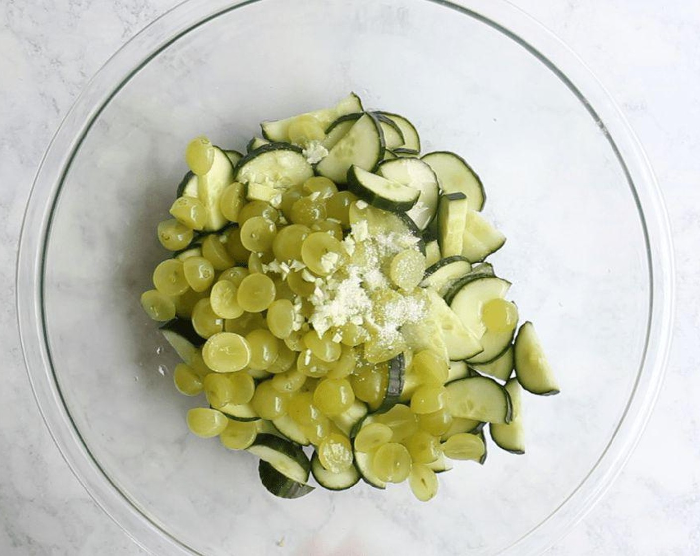 step 1 Make the gazpacho: In a large bowl, combine the English Cucumber (1), White Seedless Grapes (1 1/2 cups), and Garlic (1 clove). Add Kosher Salt (1 tsp), and White Balsamic Vinegar (4 Tbsp) toss to coat, then set aside to marinate for 20 minutes.