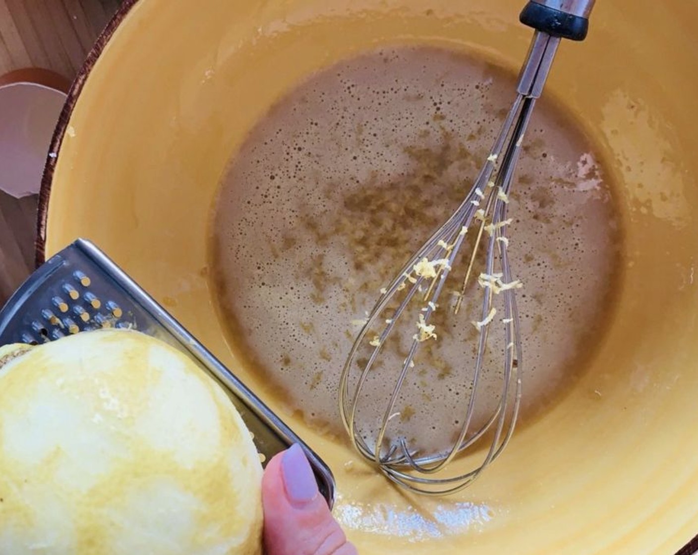 step 2 Add the Cake Flour (1 cup) and zest of a Lemon (1), stirring with a spoon, and then using your hands.