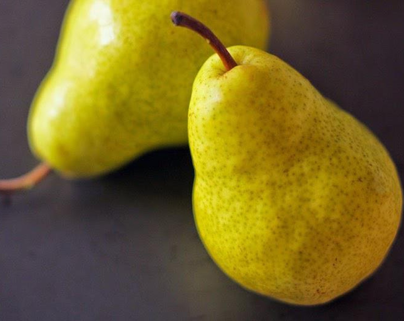 step 1 Peel Bartlett Pears (4) but leave the stems on. Coat them in juice from Lime (1) and set them aside to delay the browning process.