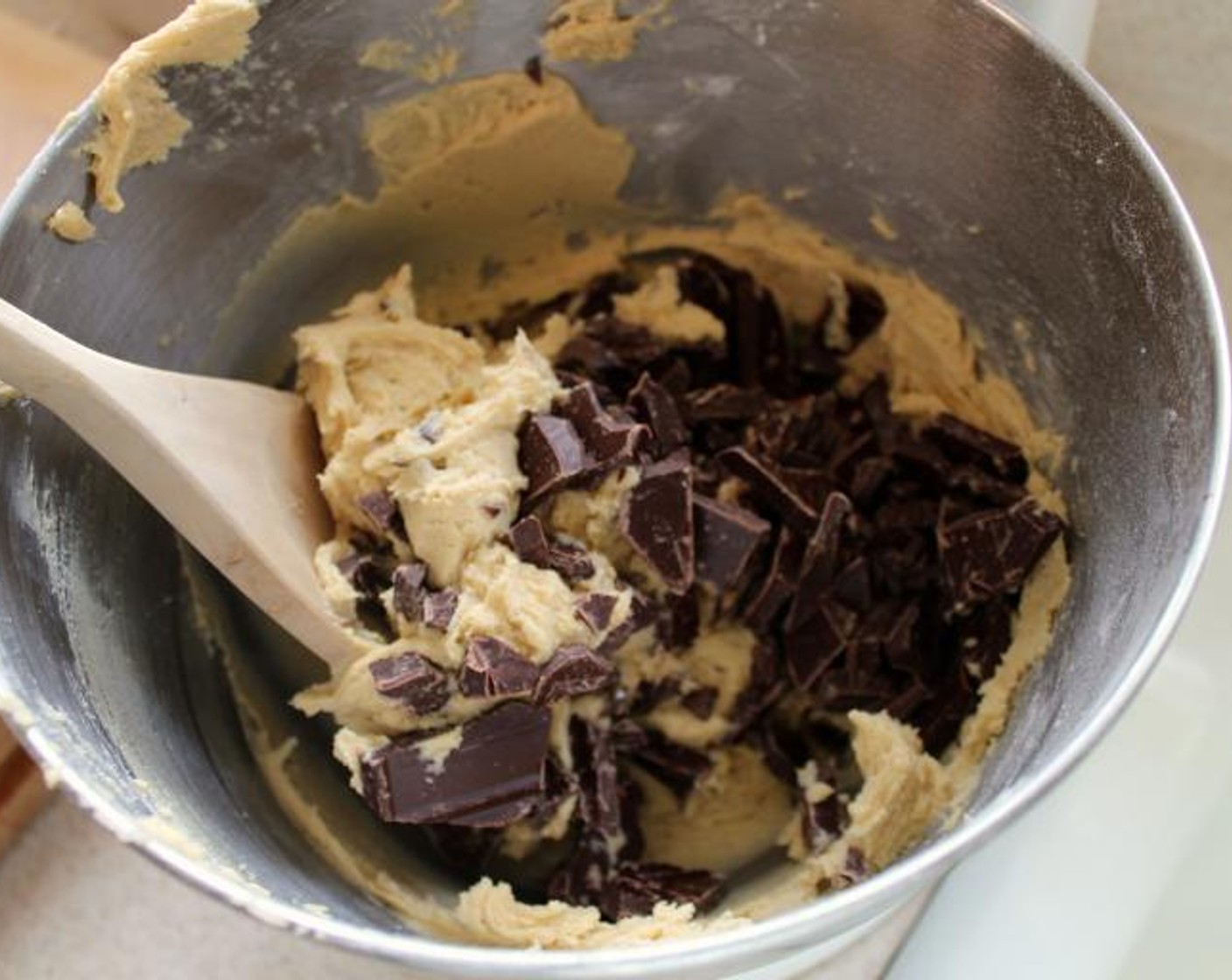 step 4 Combine the All-Purpose Flour (2 cups), Baking Soda (1 tsp), and Kosher Salt (1 tsp) in a small bowl, and with the mixer on low, add it to the butter mixture with until incorporated. Using a spoon, fold in the Semi-Sweet Chocolate Chips (1 1/3 cups) and Walnut (2/3 cup).