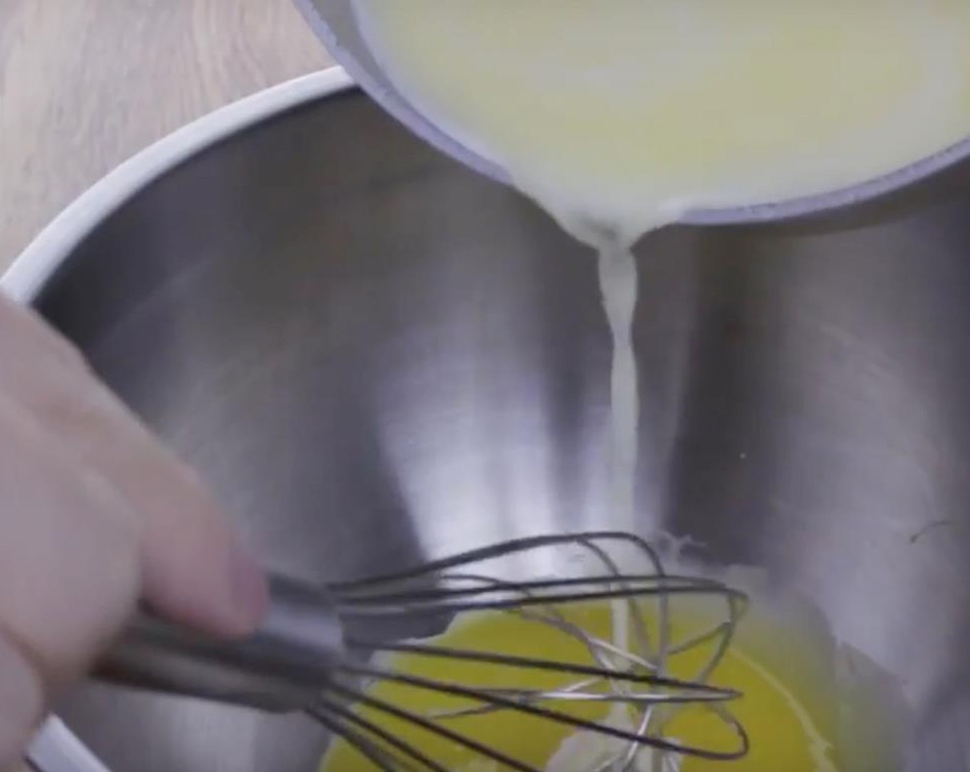 step 5 Mix well and slowly pour in the remaining warmed milk mixture as you continue to mix.