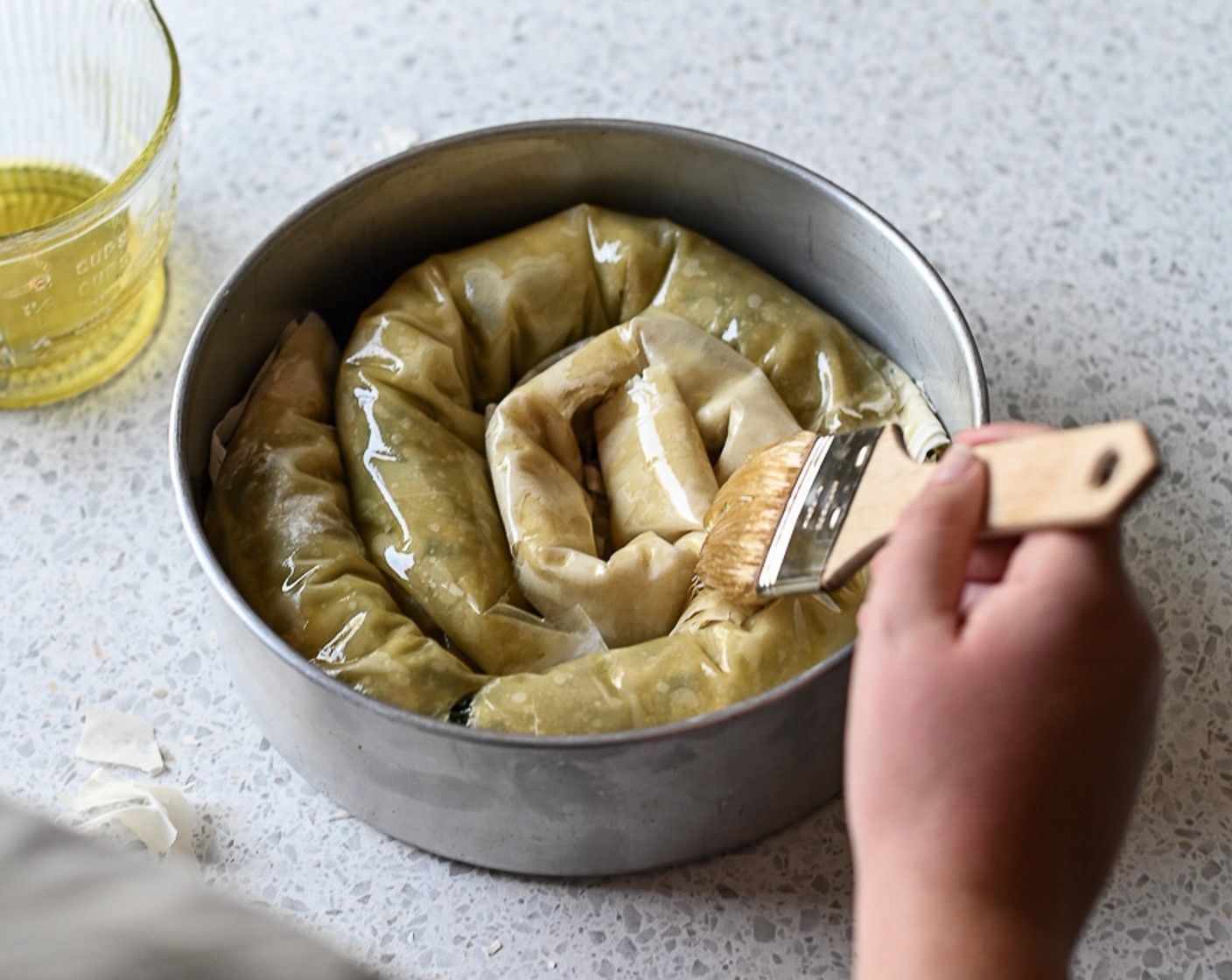 step 10 Brush the top and sides of the pinwheel with olive oil and sprinkle over a few Black and White Sesame Seeds (to taste).