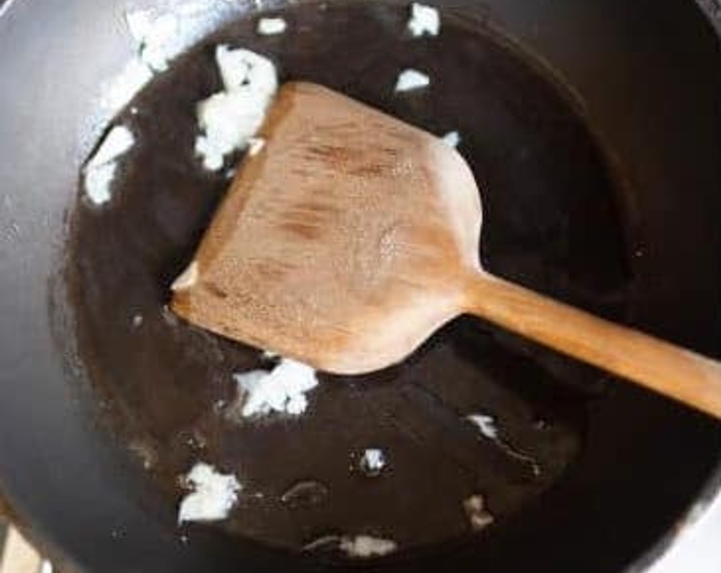 step 1 Heat Vegan Butter (1 Tbsp) in a large, non-stick frying pan, add Garlic (1 clove), and fry until golden.