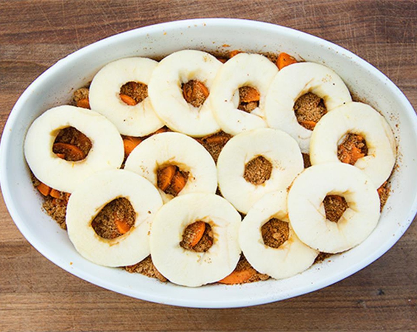 step 6 Layer sweet potatoes, brown sugar mixture and apples in prepared baking dish.