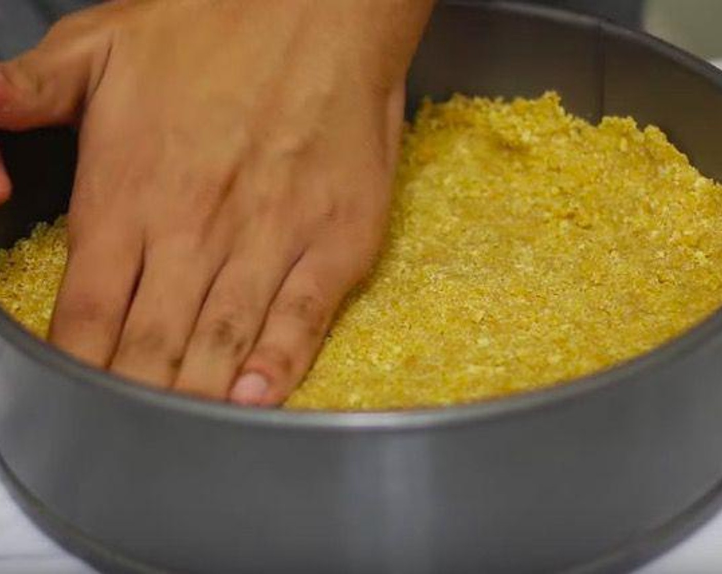 step 1 In a large bowl, add Butter (1 stick), Graham Crackers (14), Granulated Sugar (1/4 cup), and mix it together. Take a 9 inch springform pan, place the crumbs in there and use hand to form a crust.