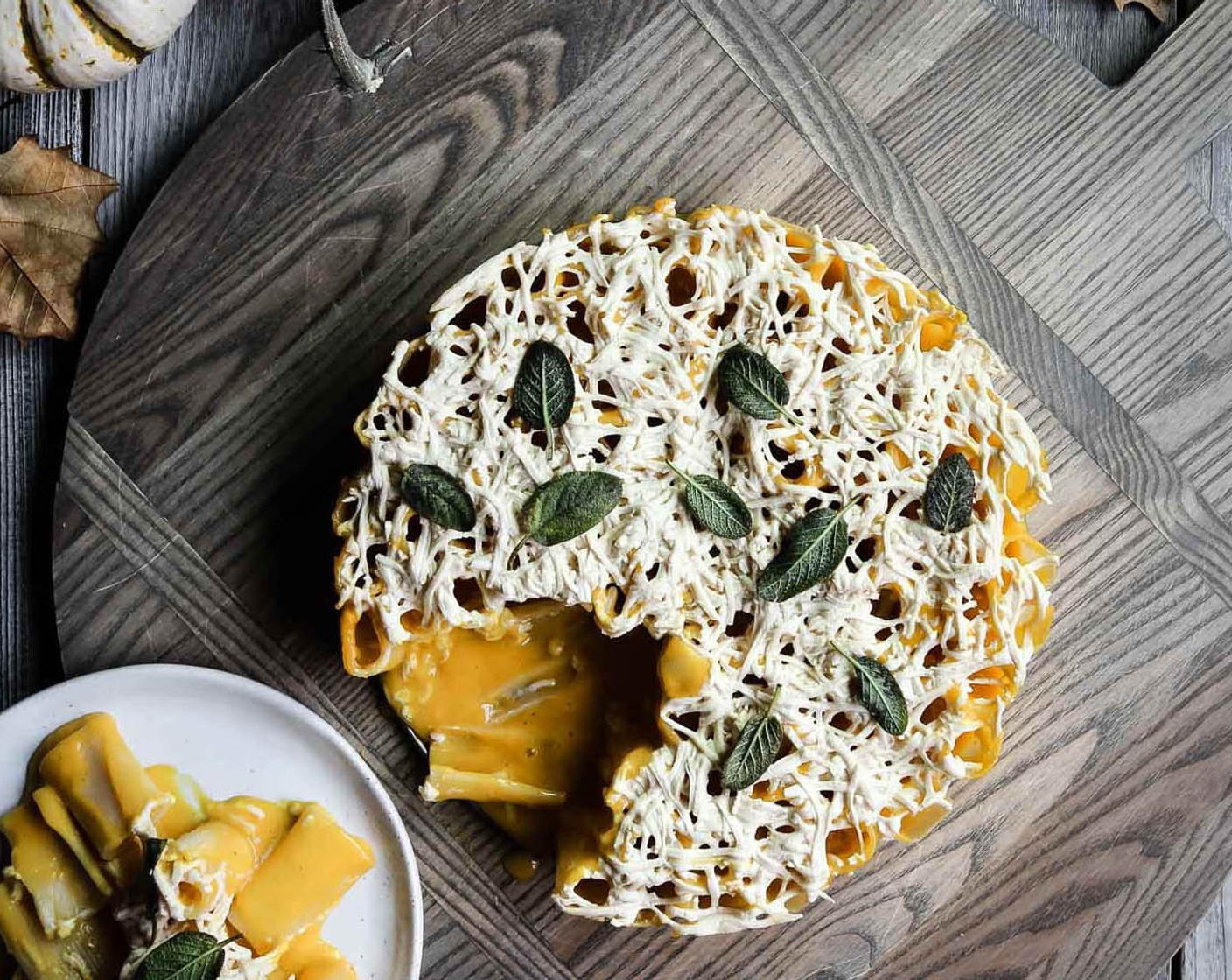 step 9 Top rigatoni pie with crispy sage leaves, run a knife along the edge of the springform pan, remove the outer ring of the pan, slice and serve.