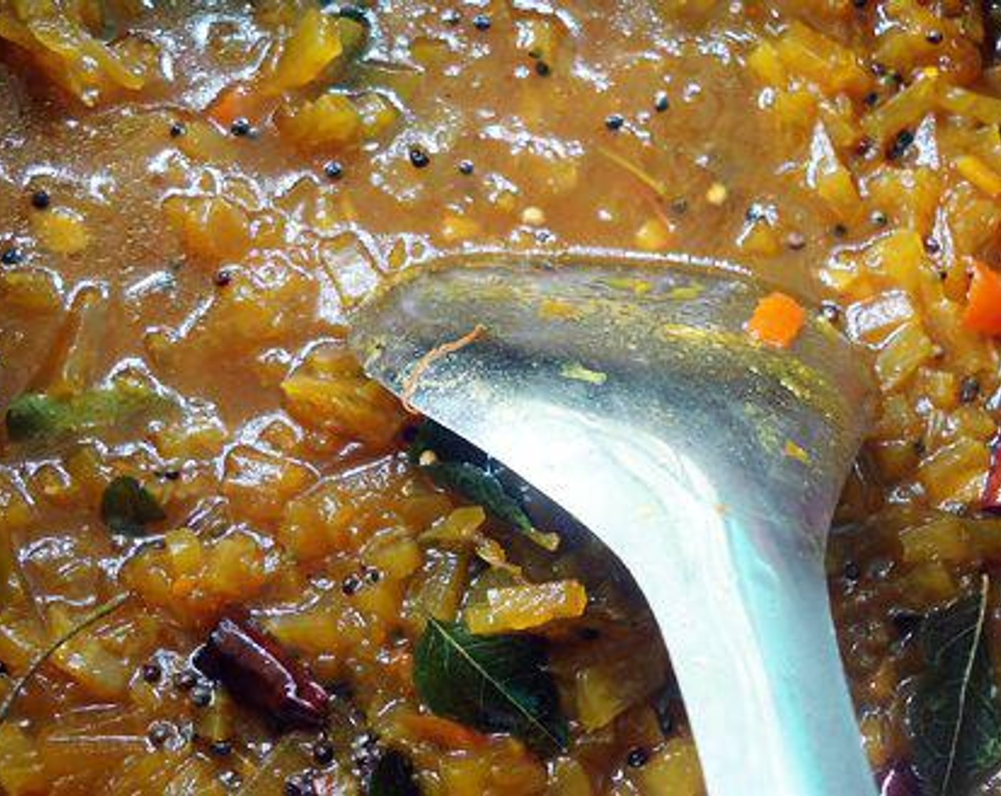 step 1 Melt Jaggery (2 pieces) in half a cup of water and filter it. Melt Tamarind Paste (1/2 cup) in water. Add melted jaggery to tamarind water and boil with Green Chili Peppers (3) and Fresh Ginger (1/2 tsp).