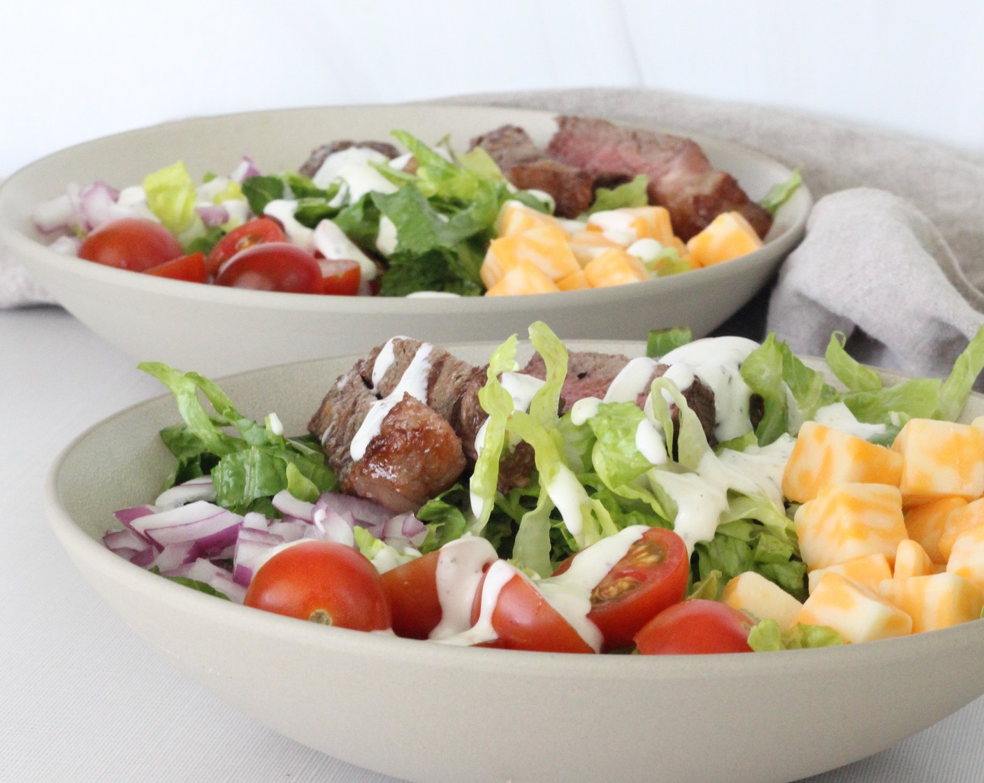 step 5 Top salads with sliced steak and add Ranch Dressing (1/3 cup) as desired.