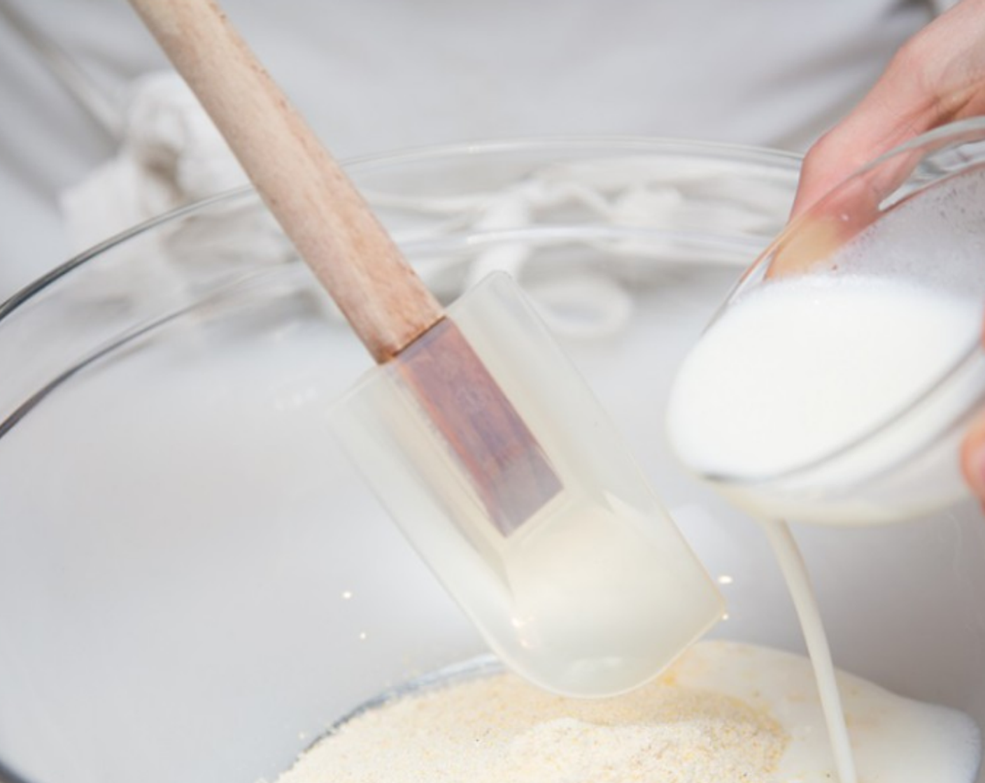 step 9 Place the Cornbread Mix (1/2 cup) in a mixing bowl - with the Raw Cane Sugar (1 tsp), if you like your cornbread Yankee-style - and gently stir in the buttermilk/oil mixture.