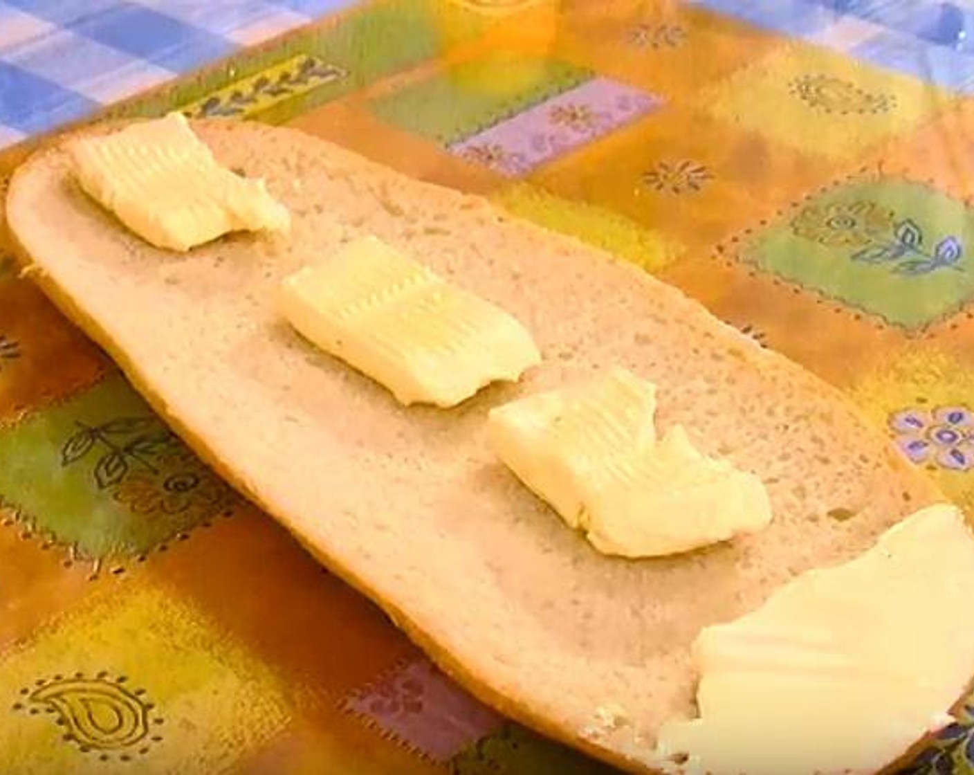 step 2 Take your Butter (3.5 oz) and put it over the first slice of your bread.