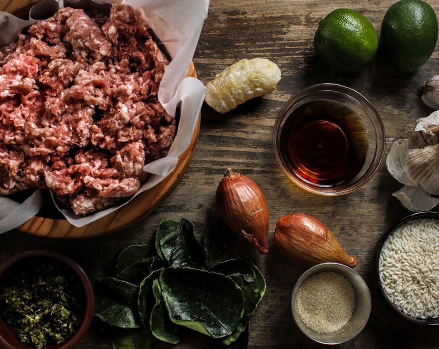 step 4 In a large bowl, combine the Ground Pork (1.5 lb), juice of the Lime (1), Fish Sauce (3 Tbsp), Granulated Sugar (1 Tbsp), glutinous rice powder and freshly ground spices together and combine it by hand or stand mixer.