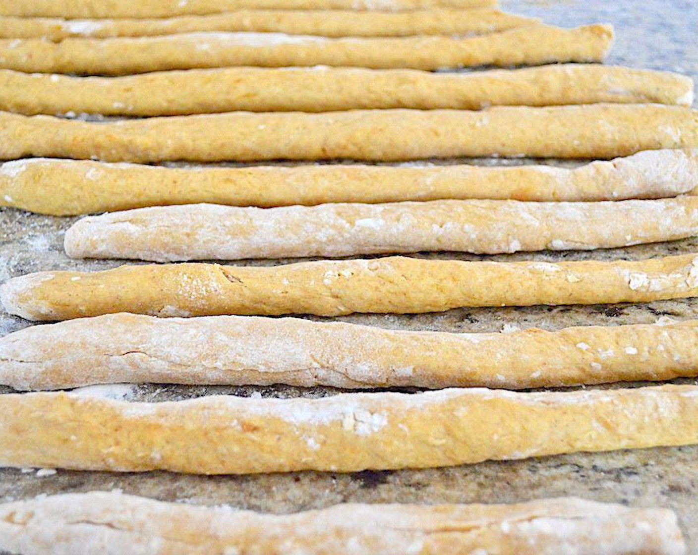 step 5 Knead the dough a couple of times to make sure it is well incorporated, but don't over handle it. Form it into a loaf and slice it into thin little slices. Make each slice into a thin, long log by rolling the slice under your hands back and forth. Then cut each slice into little 1-inch pieces.