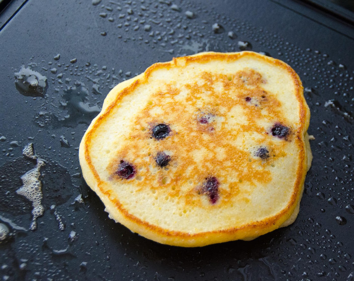 step 6 Cook pancakes 2 to 3 minutes or until lightly browned on the bottom. Carefully flip with a spatula and cook for an additional 2 to 3 minutes.