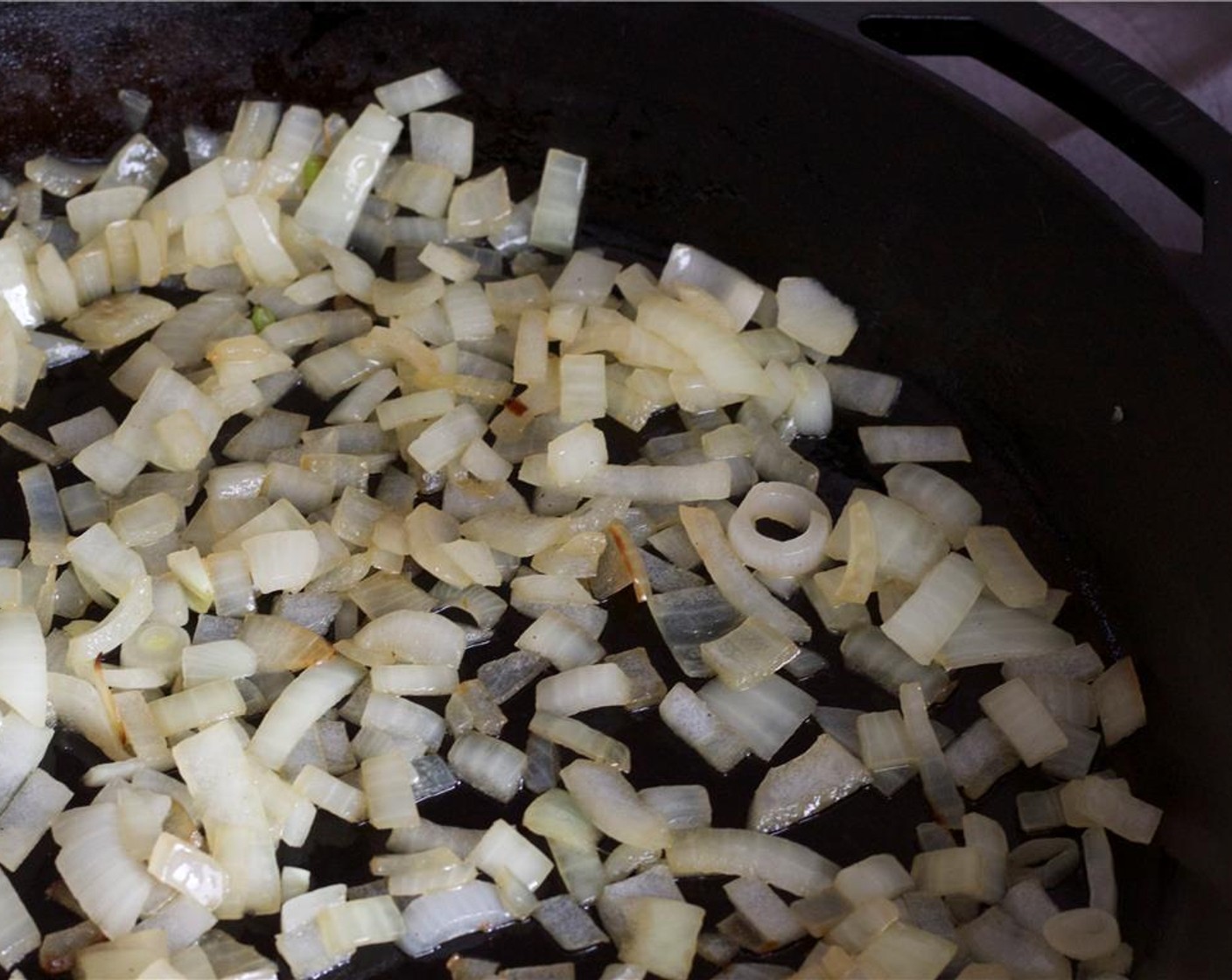 step 3 Heat about 1 tablespoon of oil in a large skillet over medium heat. Saute the Onion (1) for 3 to 5 minutes, until soft and translucent.