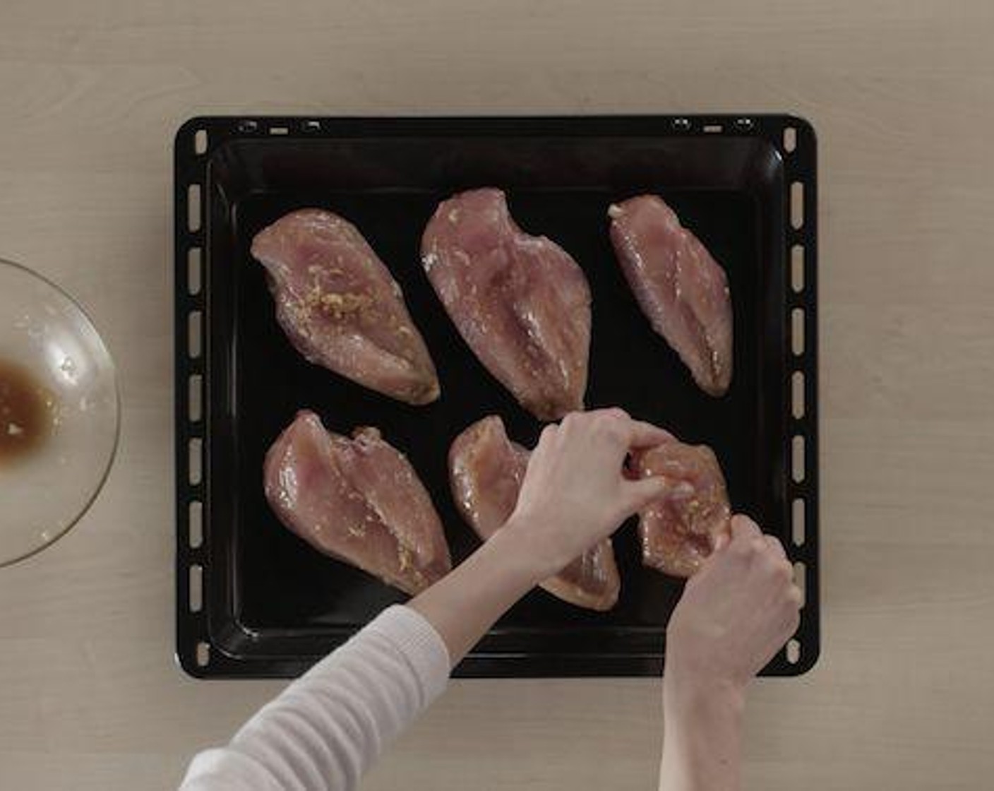 step 5 Place the marinated pieces on the preheated baking tray to get a crispy texture.