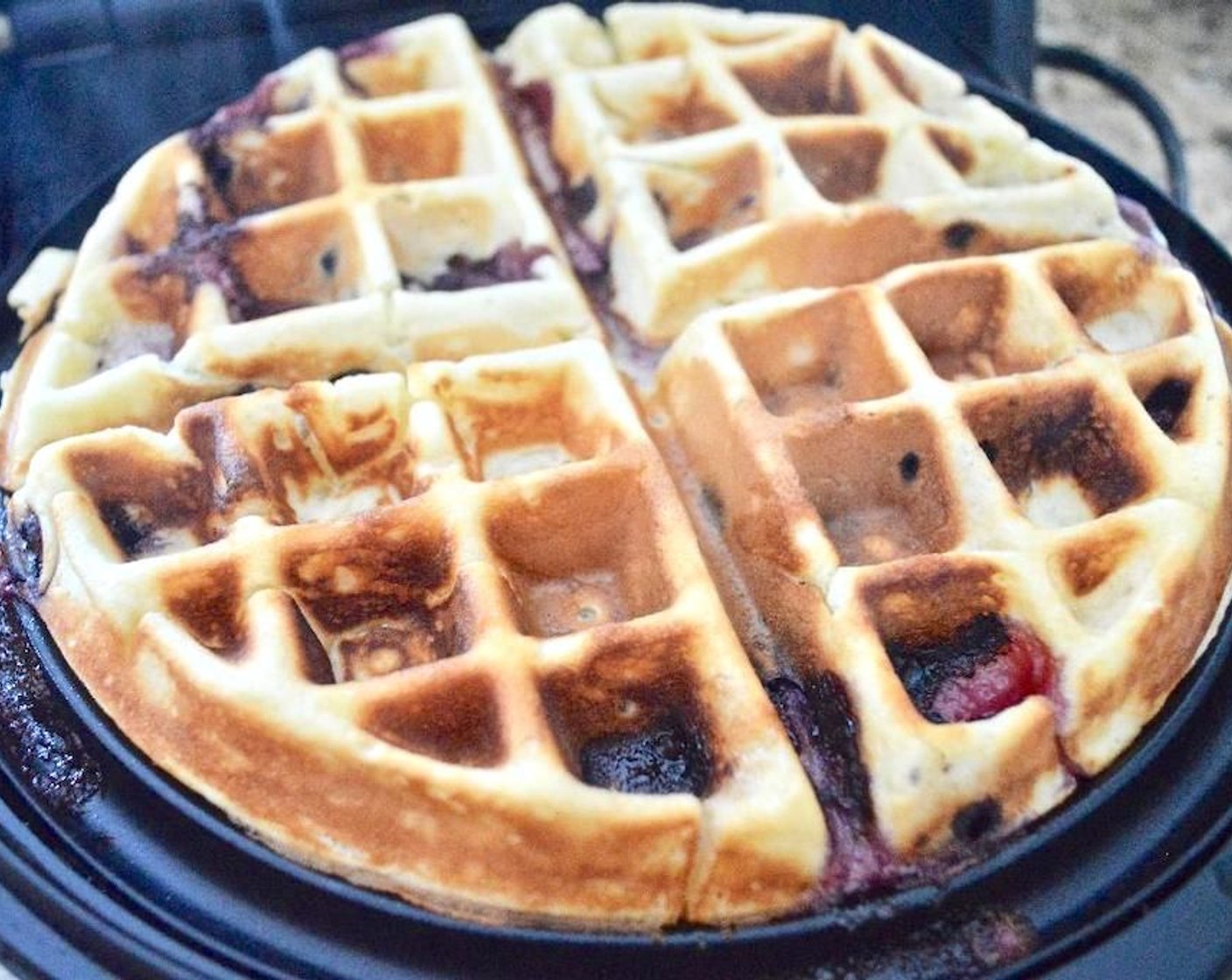 step 3 Scoop 1/4 of the batter into the waffle maker and ensure it is evenly spread out. Cook the batter for about 5 minutes, until puffy and golden.