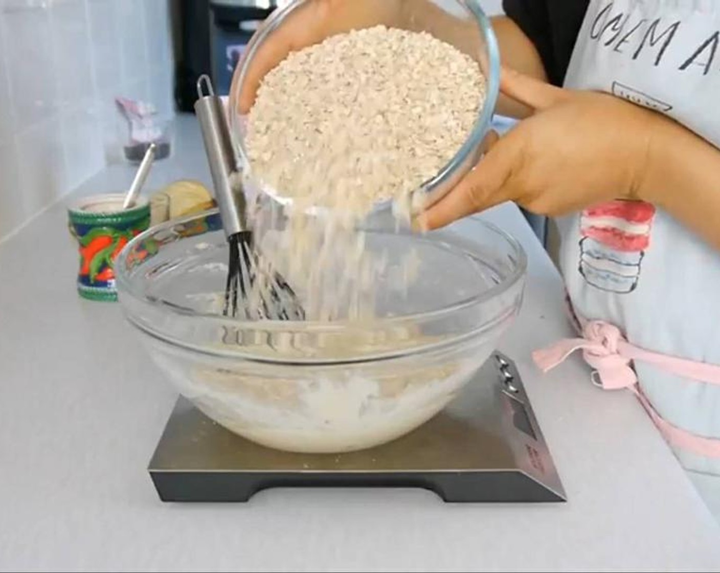 step 4 Add the Oats (4 1/2 cups) and mix well using a spoon. You mind it easier to mix using your hands. Once all the oats are mixed add the Baking Powder (1 tsp), Dark Chocolate Chips (1/4 cup), and banana crisps and continue to mix with your hands. Add the Honey (2 Tbsp) and continue to mix.