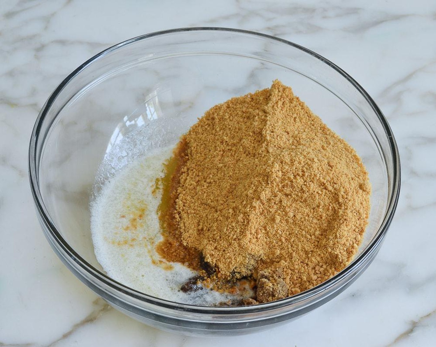 step 2 In a medium bowl, combine the Graham Cracker Crumbs (1 cup), Unsalted Butter (1/4 cup), Dark Brown Sugar (1/4 cup), and Salt (1 pinch). Using a spoon first and then your fingers, mix until evenly combined, making sure to break up any lumps of brown sugar.