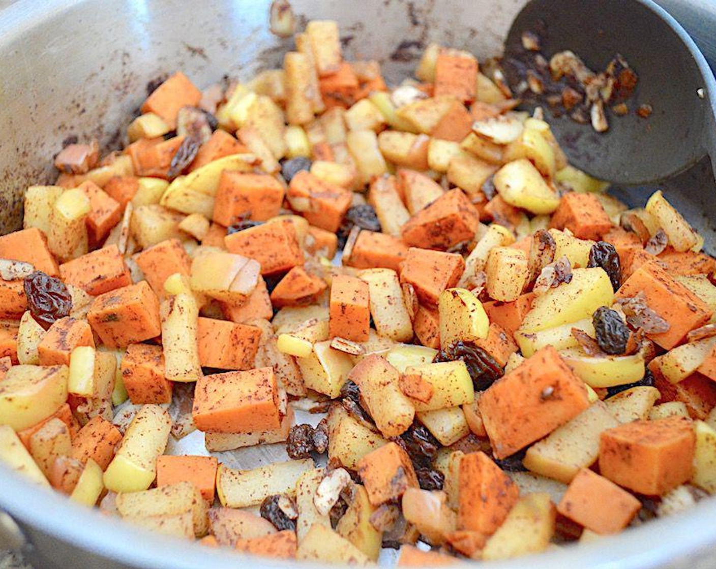 step 2 Heat the Coconut Oil (1 Tbsp) in a large skillet with deep sides. Add the Sweet Potatoes (2), Apples (2), Ground Cinnamon (1 tsp), and Ground Ginger (1/4 tsp) and let them soften to become really fragrant for 5 minutes or so.