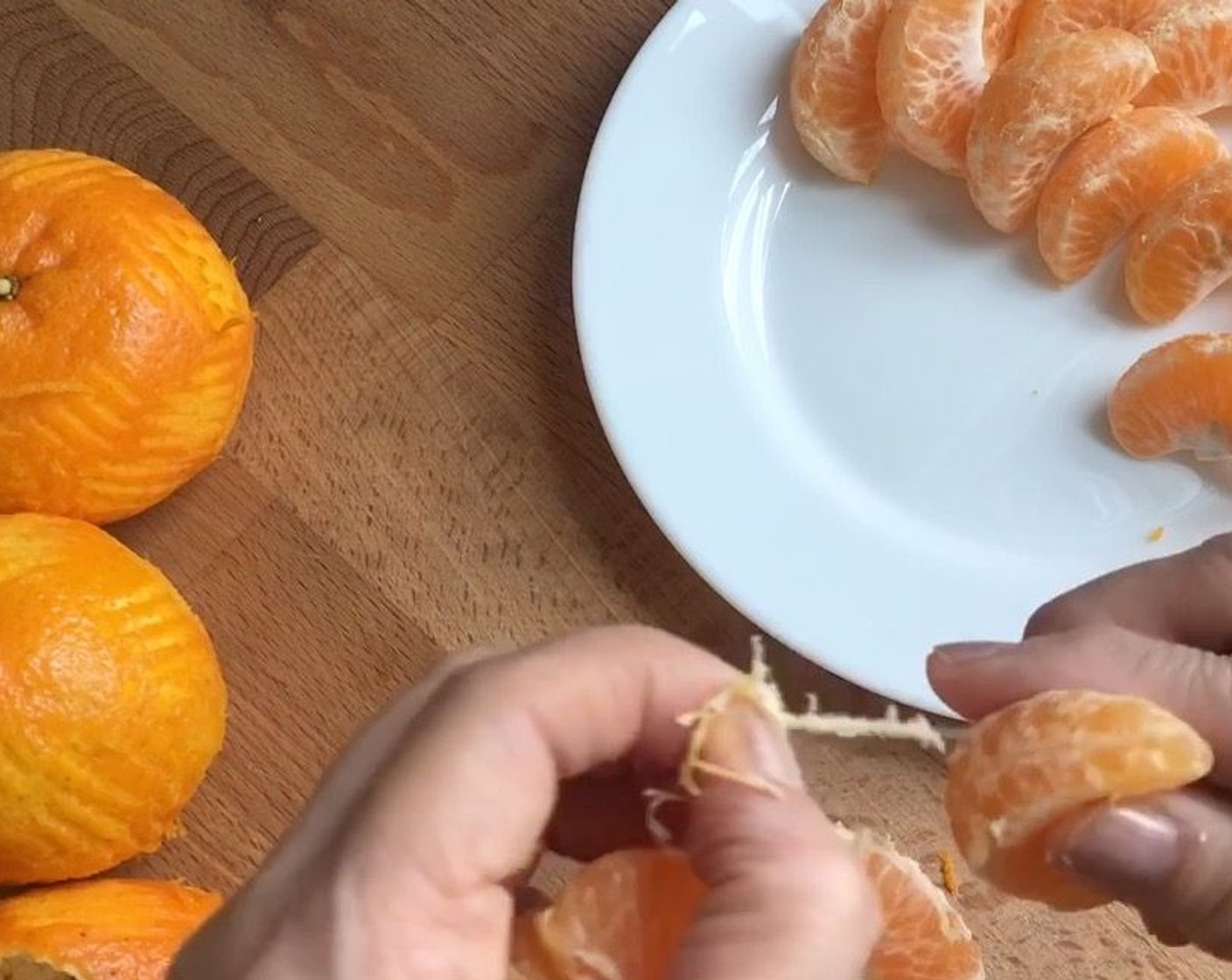 step 2 Peel to remove the skin, remove pith, seeds and break into segments.