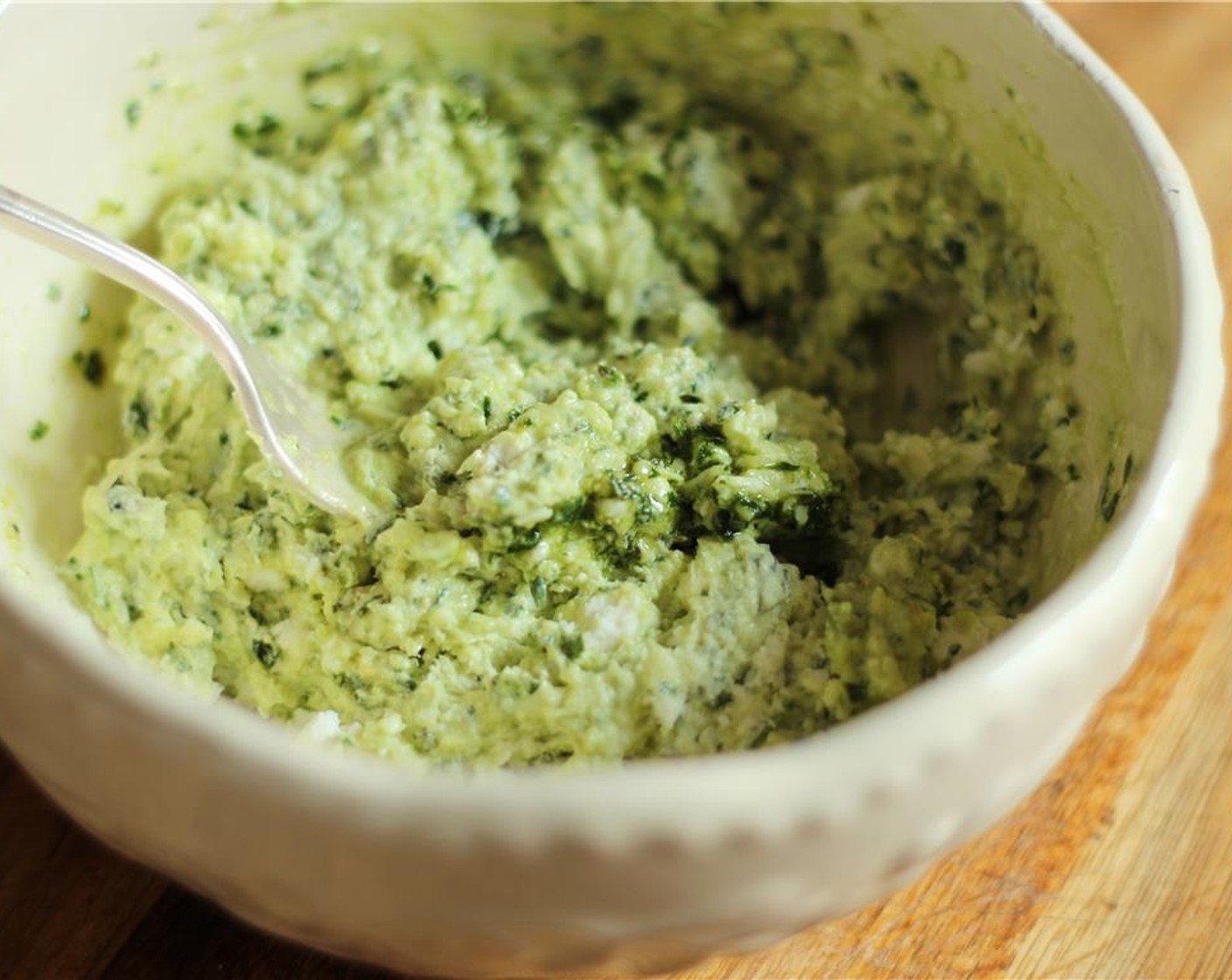 step 5 Stir in the Basil Pesto (1/4 cup) and Heavy Cream (2 Tbsp). Whip with the fork until smooth and creamy. Adjust seasonings to taste.