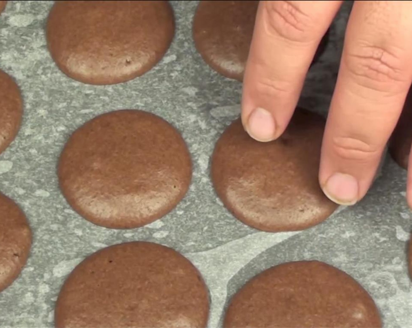 step 5 Put batter into a pastry bag, and pipe into uniform rounds on a greased baking sheet. Bang tray down on a flat surface. Let sit for 1 hour. Once you can touch them without them sticking, they are ready for the oven.