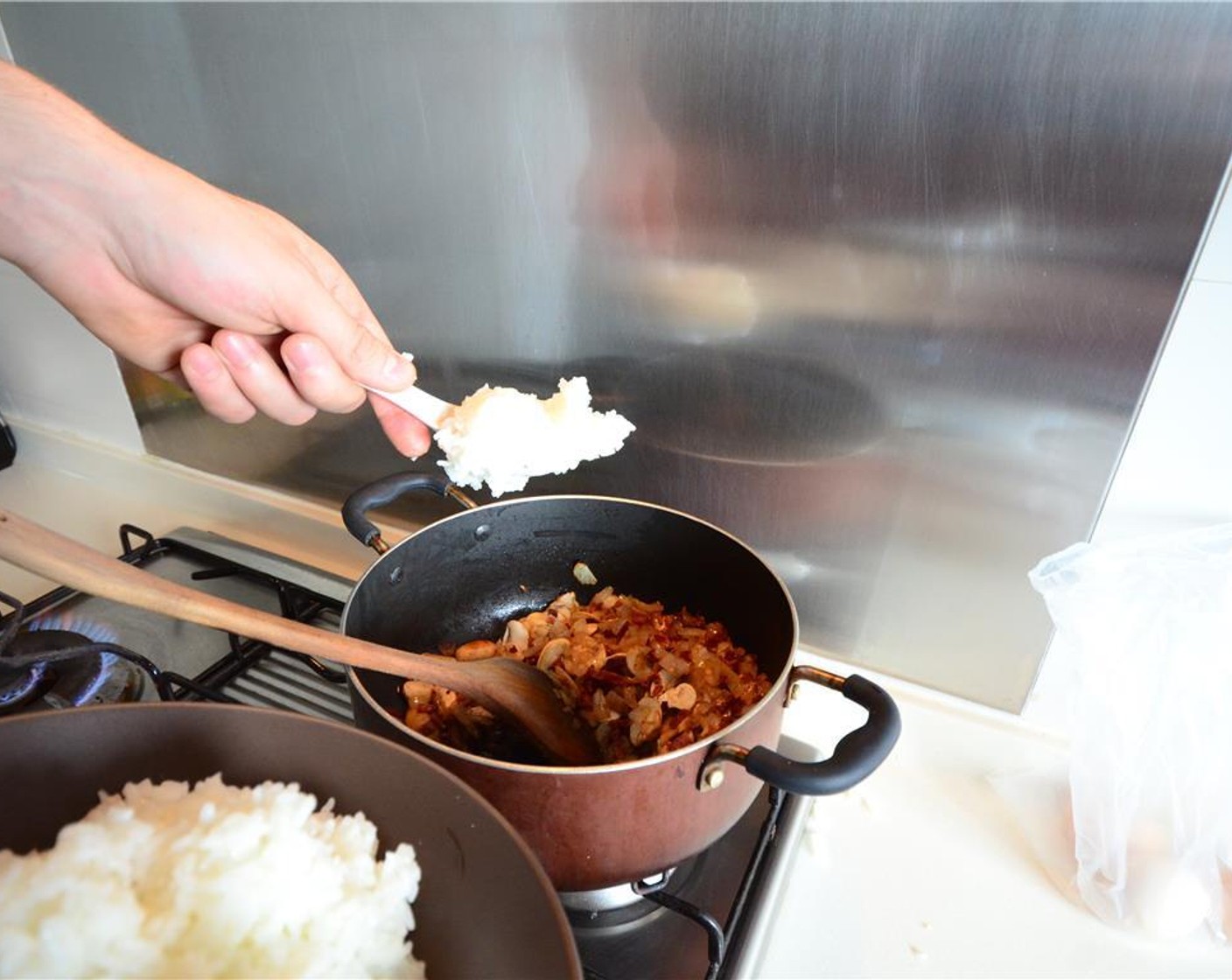 step 8 Add the cooked White Rice (1 cup) and fry for 2 minutes.