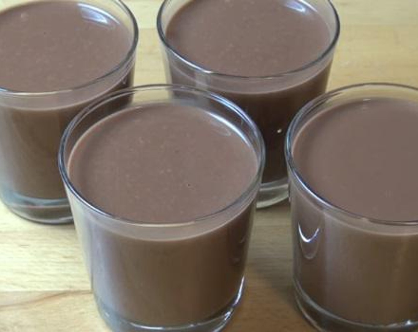 step 3 Pour the chocolate mixture into serving glasses, and put these into the fridge for about 6 hours to set.