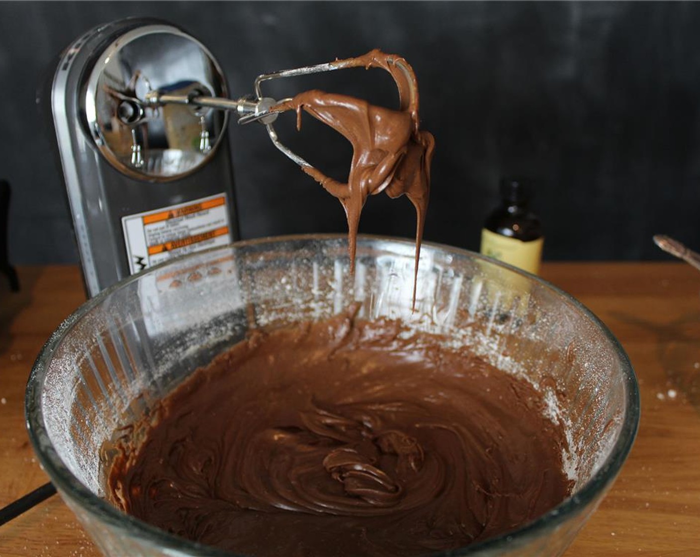 step 11 Gradually add remaining Powdered Confectioners Sugar (2 cups) one cup at a time until the frosting is smooth and fluffy. Beat in the Vanilla Extract (2 tsp).