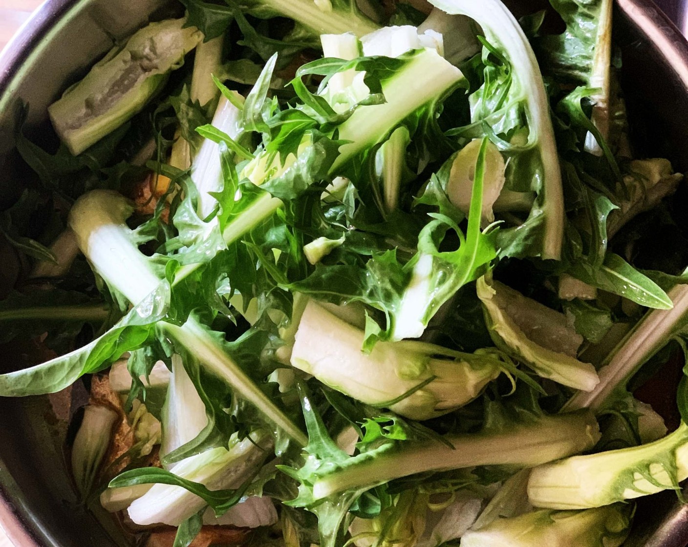 step 2 Add the Chicory (1 head) to the skillet. Season with Salt (1/2 tsp). Stir around for 1-2 minutes then add Water (2 Tbsp), lower heat, cover with a lid and let cook until veggies are soft.