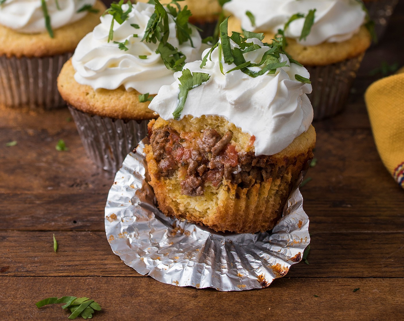 step 4 Bake for 15 to 17 minutes or until a toothpick inserted into the cupcake comes out clean and the cupcakes are golden brown. Cool the cupcakes slightly. Frost the tops with Sour Cream (1 1/2 cups). Sprinkle with Fresh Cilantro (to taste).
