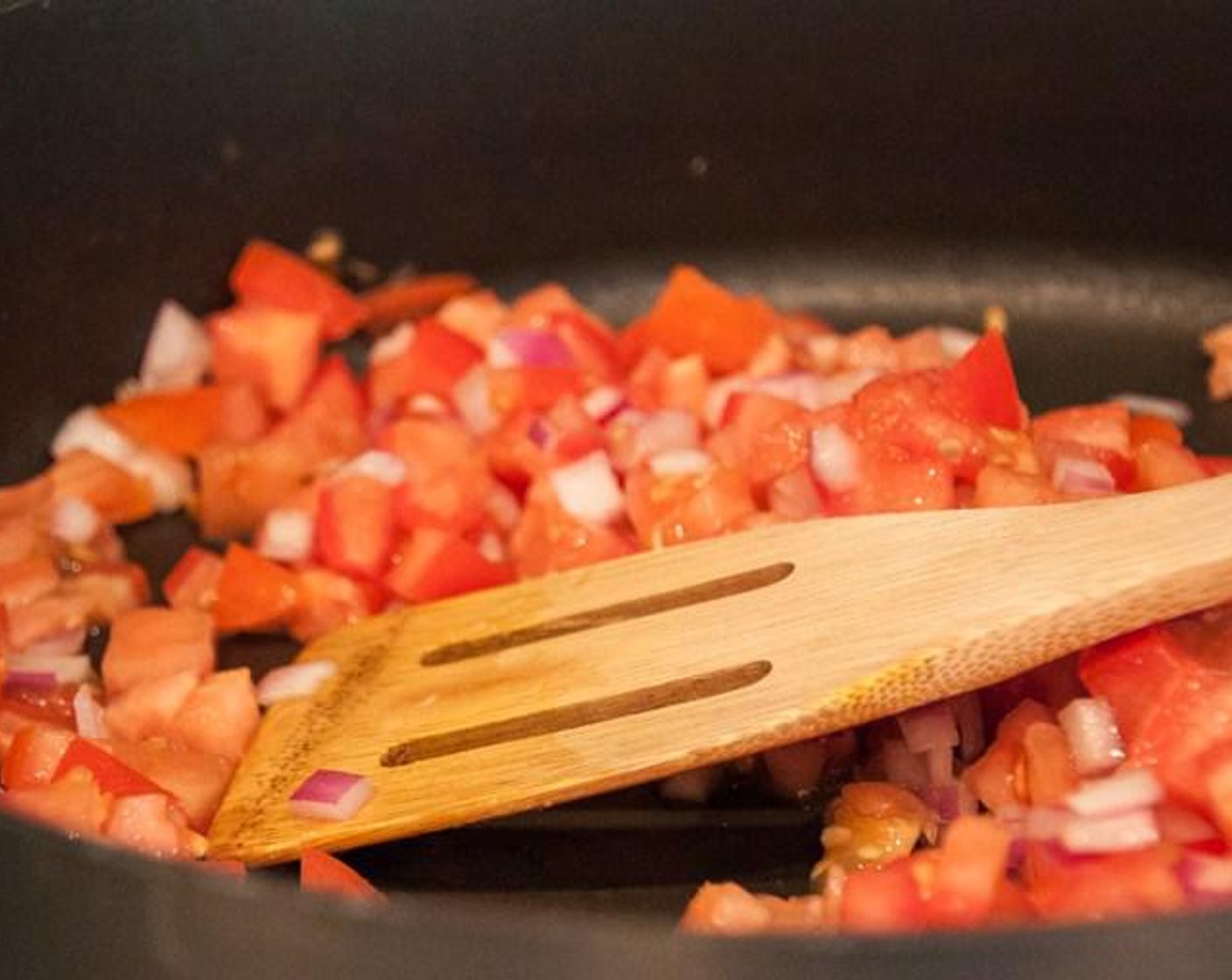 step 3 Heat Olive Oil (1 tsp) in a large skillet or pot over medium heat. Add the Red Onion (1),Fresh Ginger (2 Tbsp), Garlic (1 clove), and Tomatoes (3), and cook until the onions have browned and the tomatoes start to break down. About 5-10 minutes.