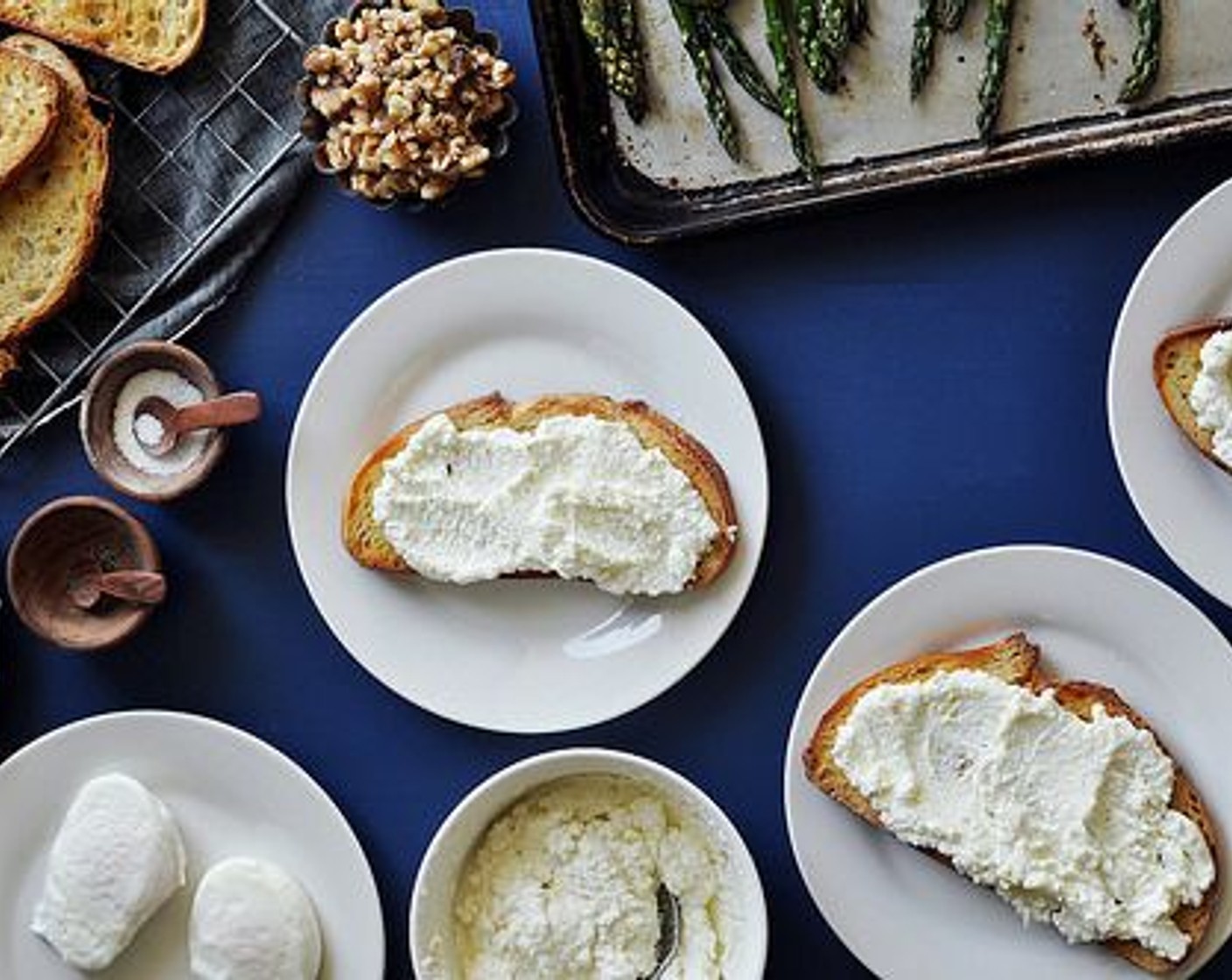 step 12 To assemble the sandwiches, spread some ricotta on each slice of toasted bread.