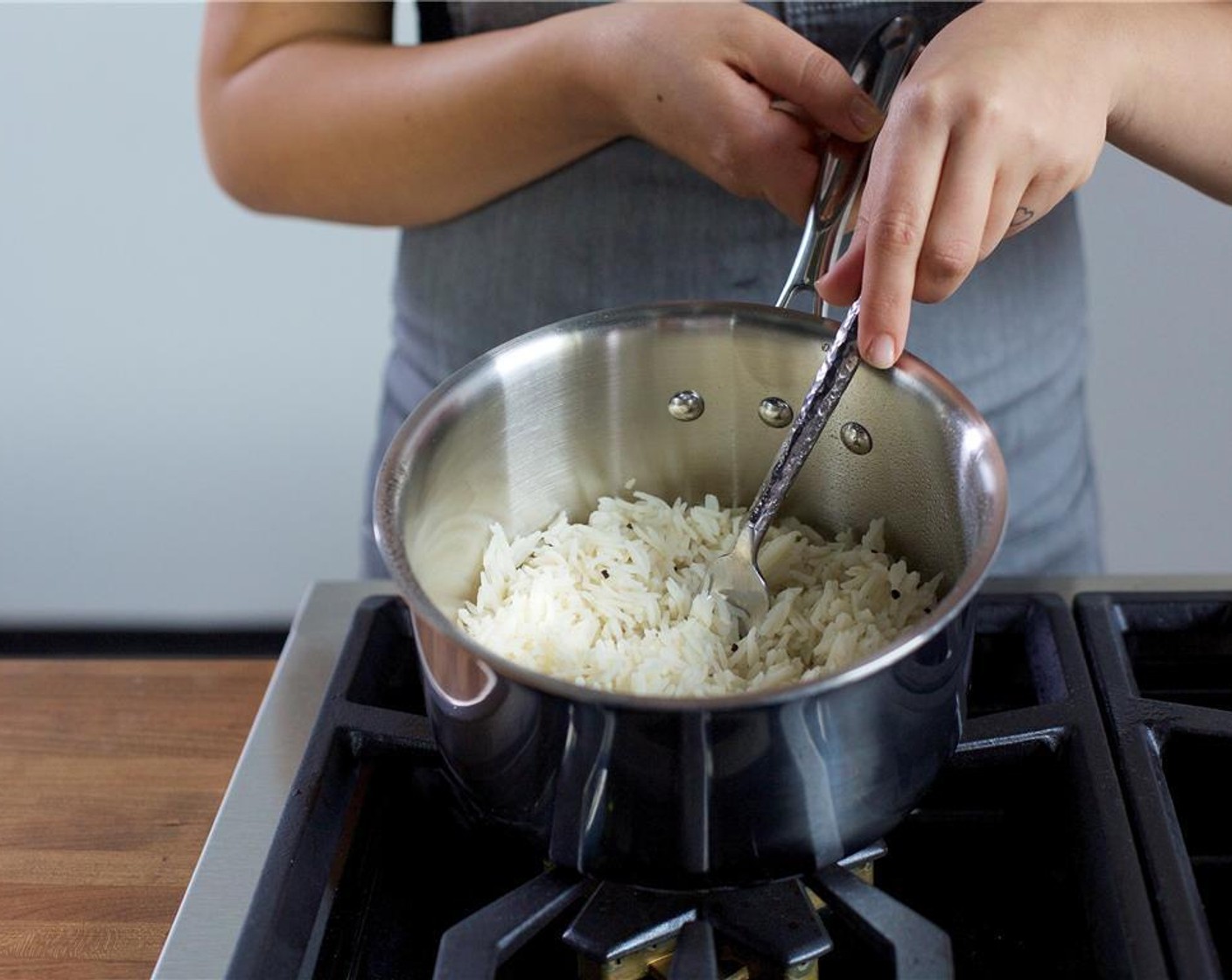 step 11 Remove from heat, fluff rice with a fork, and keep warm until plating.