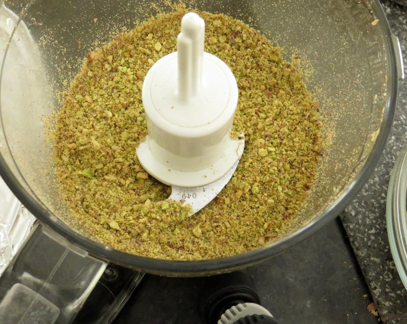 step 3 Using a food processor, pulse Shelled Unsalted Pistachios (3/4 cup) until finely ground, about 40 seconds. Add All-Purpose Flour (1 cup), Baking Powder (2 tsp), Ground Cardamom (1 tsp), and Salt (1/4 tsp). Pulse a few times to combine.