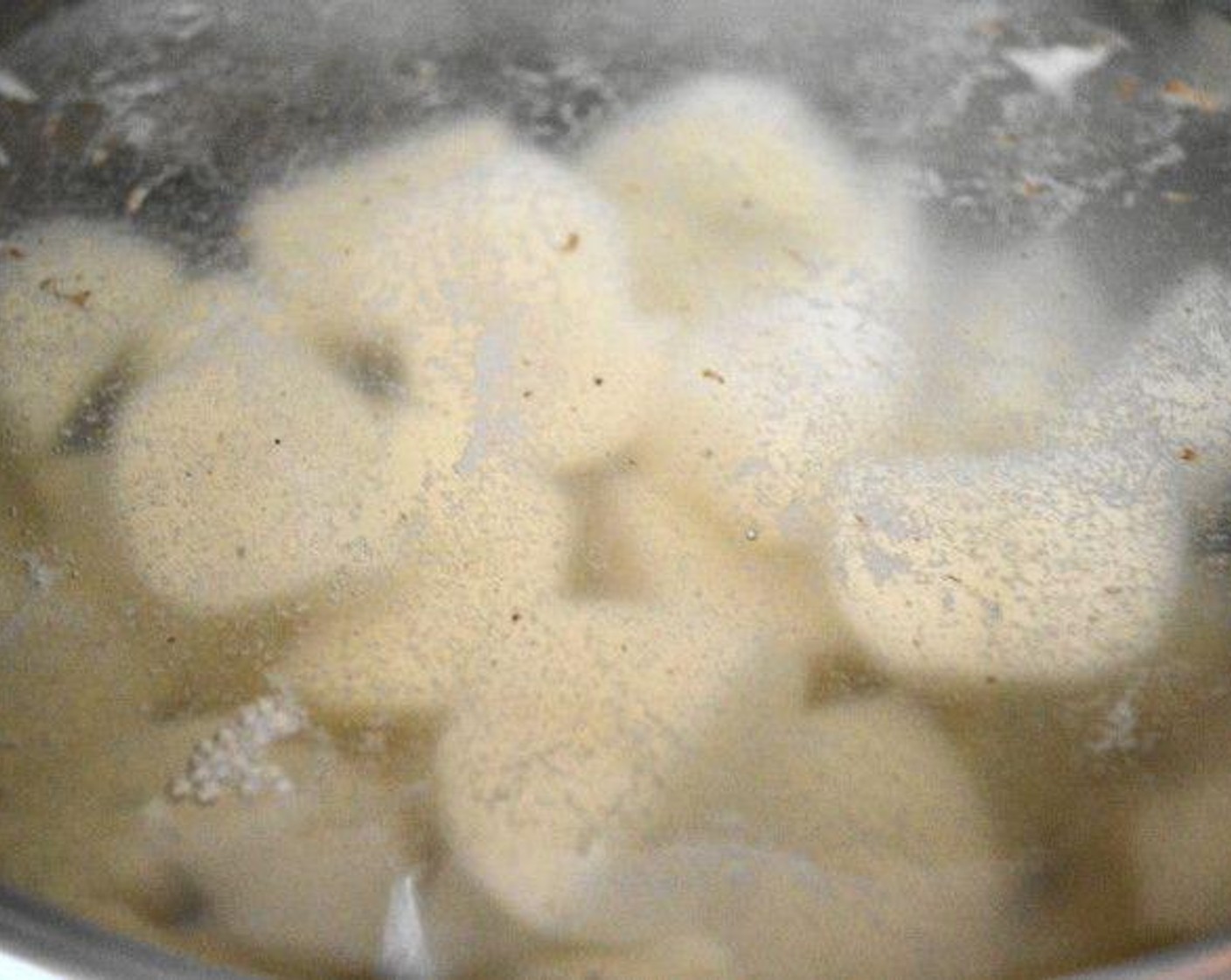 step 1 Start preparing the filling. Fill a large pot with cold water and put it on the stove, then salt the water generously. Get the Yukon Gold Potatoes (10) into the pot and bring the water to a boil. Boil the potatoes until they are completely tender and mashable, which takes about 20-25 minutes.