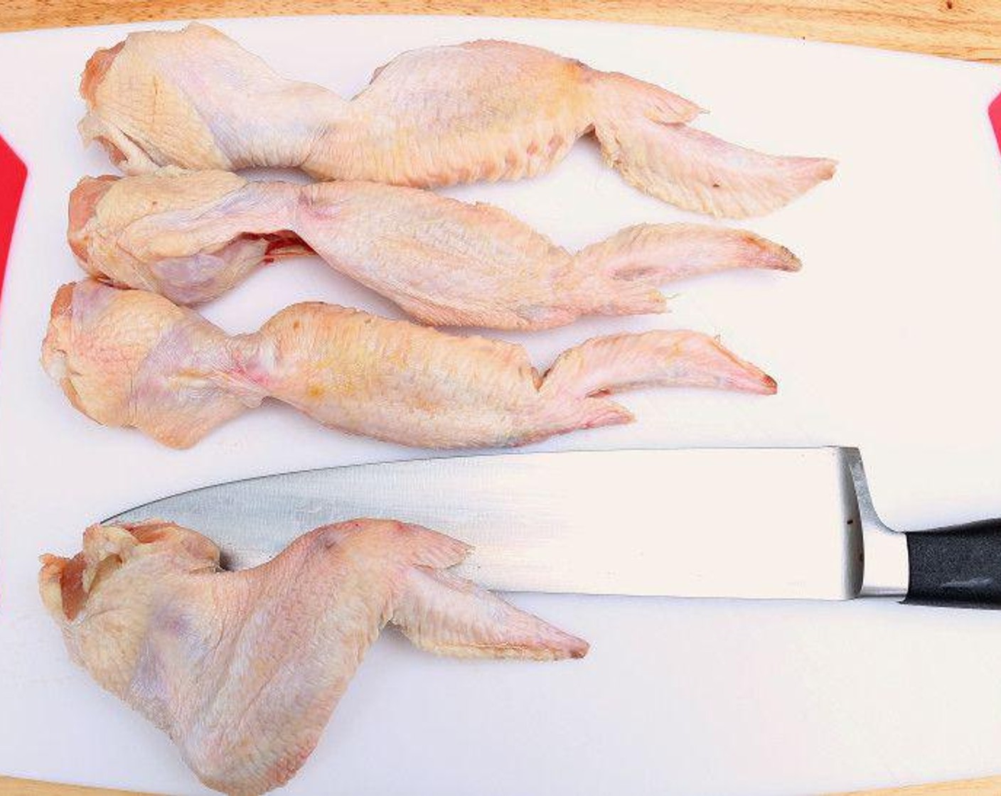 step 1 Cut the tendon’s of Chicken Wings (12) to keep them straight during cooking.