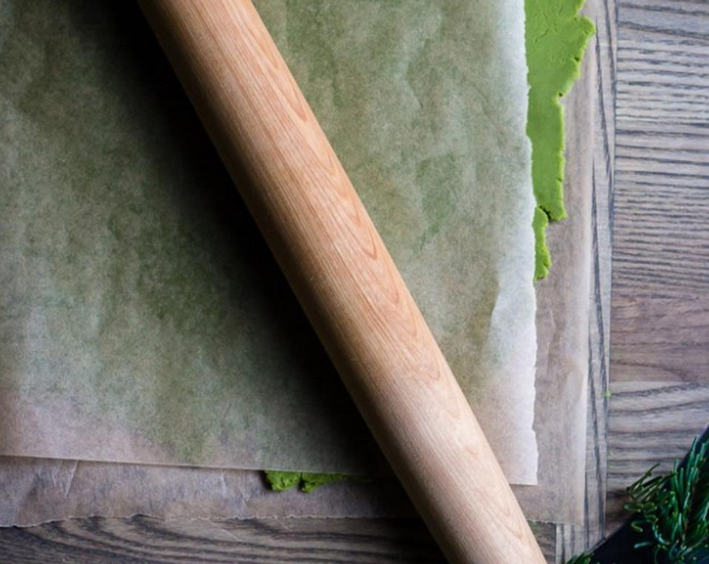 step 5 Roll out the dough between two sheets of parchment paper and roll into a rectangle (give or take) until it is uniformly about 1/4" - 3/8" thick.